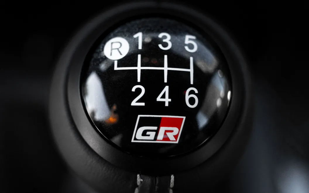 A photo of a shifter on a manual transmission car.