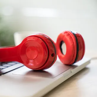Headphone sitting on a laptop